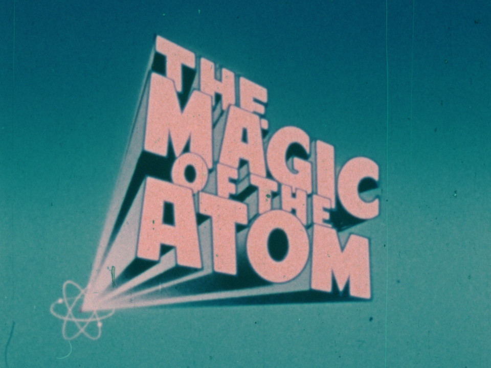 Title card from a film, badly faded to pink. Text is "The Magic of the Atom".
