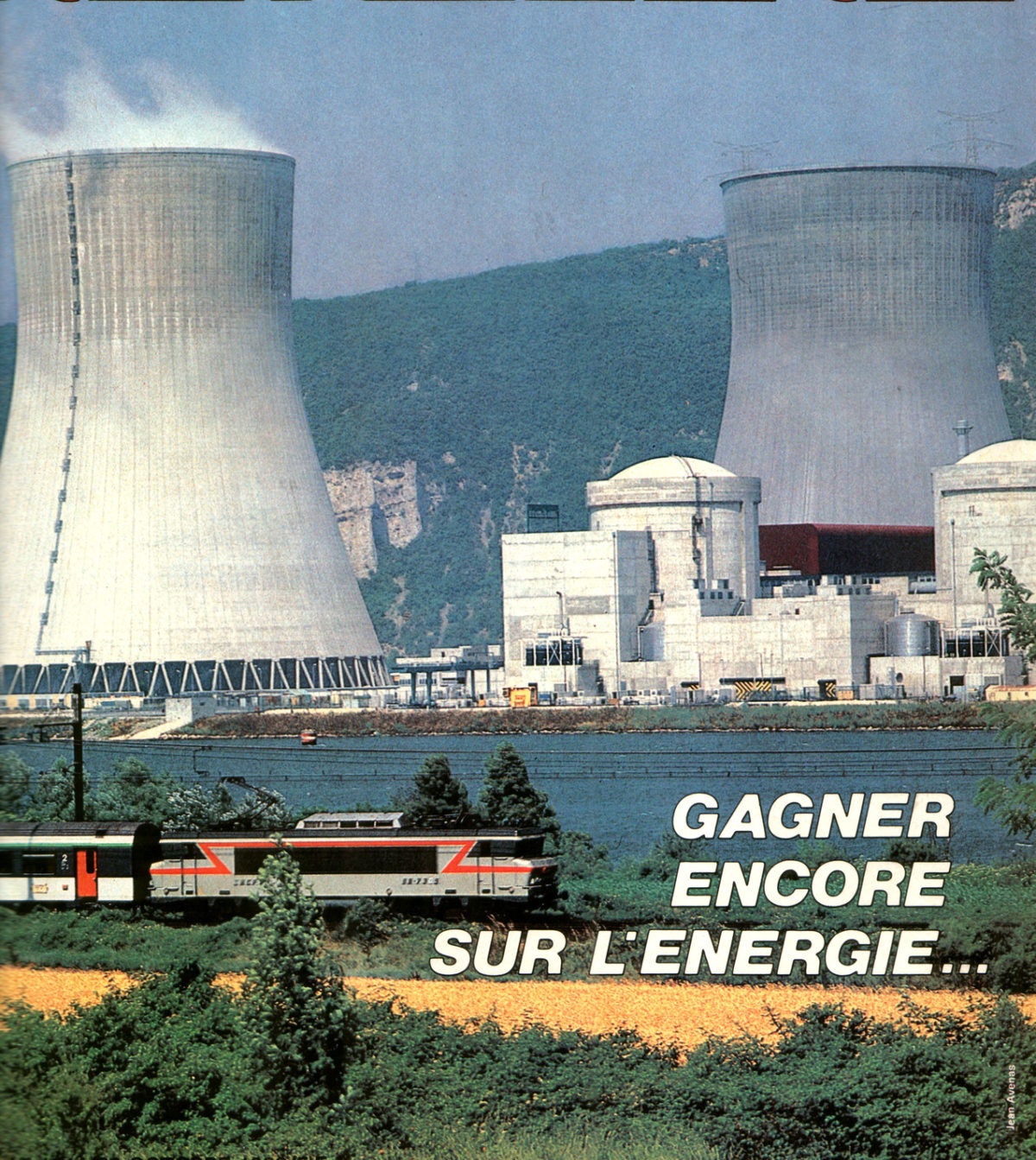 SNCF passenger train passing in front of Cruas nuclear power station.